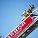 A firefighter climbs down a latter near the intersection of Church Street and South University Avenue on Monday. Apartments above were evacuated. Daniel Brenner I AnnArbor.com